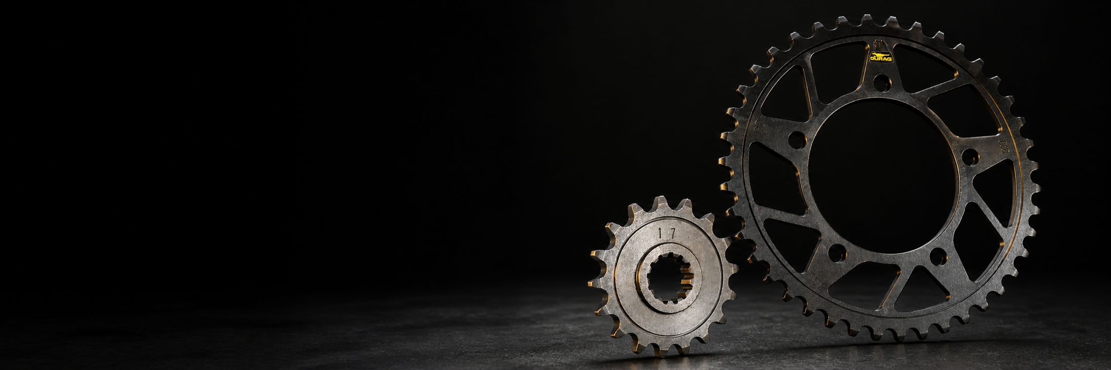 DURAG rear and front sprockets on a dark studio surface
